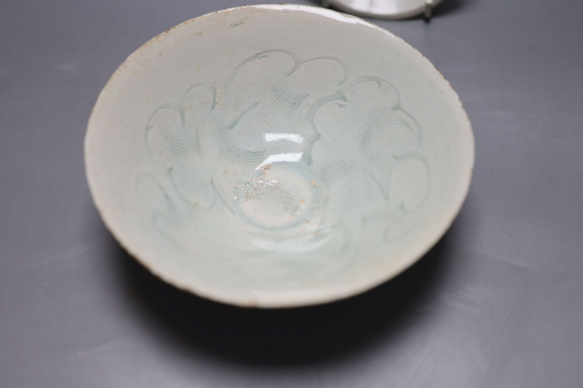 An 18th century Chinese famille rose tea bowl, together with a Qingbai type bowl and dish, largest diameter 17cm